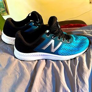 New Balance. Blue and black. Size 12. Great running shoes.